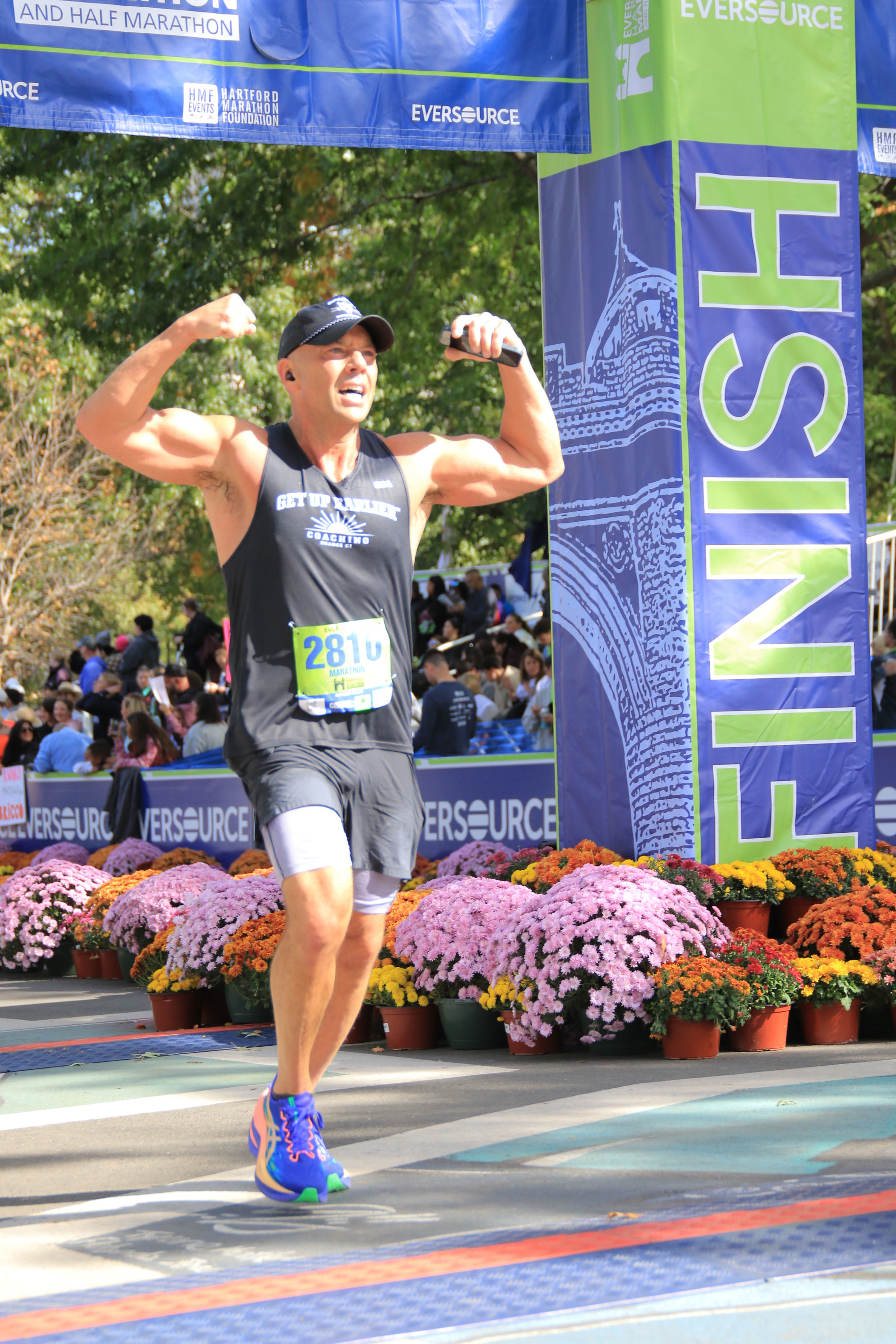 Michael Baker crossing the Hartford Marathon finish line