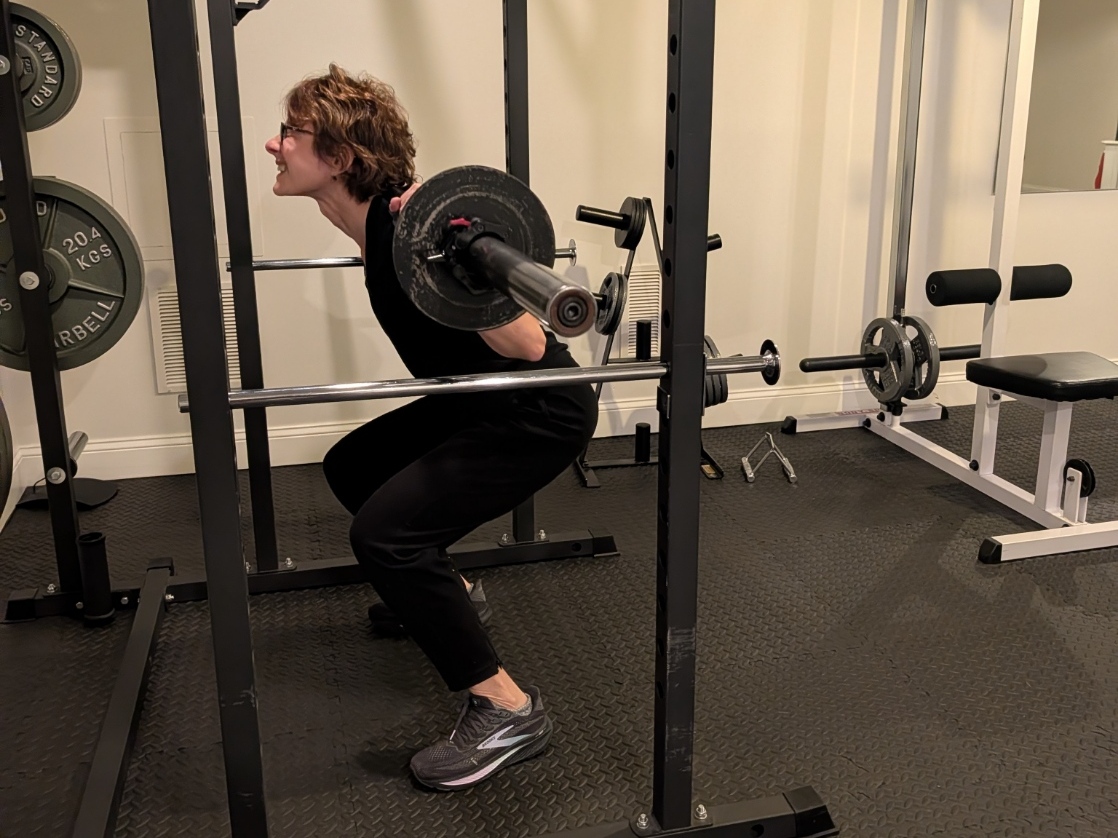 Amy performing a barbell back squat